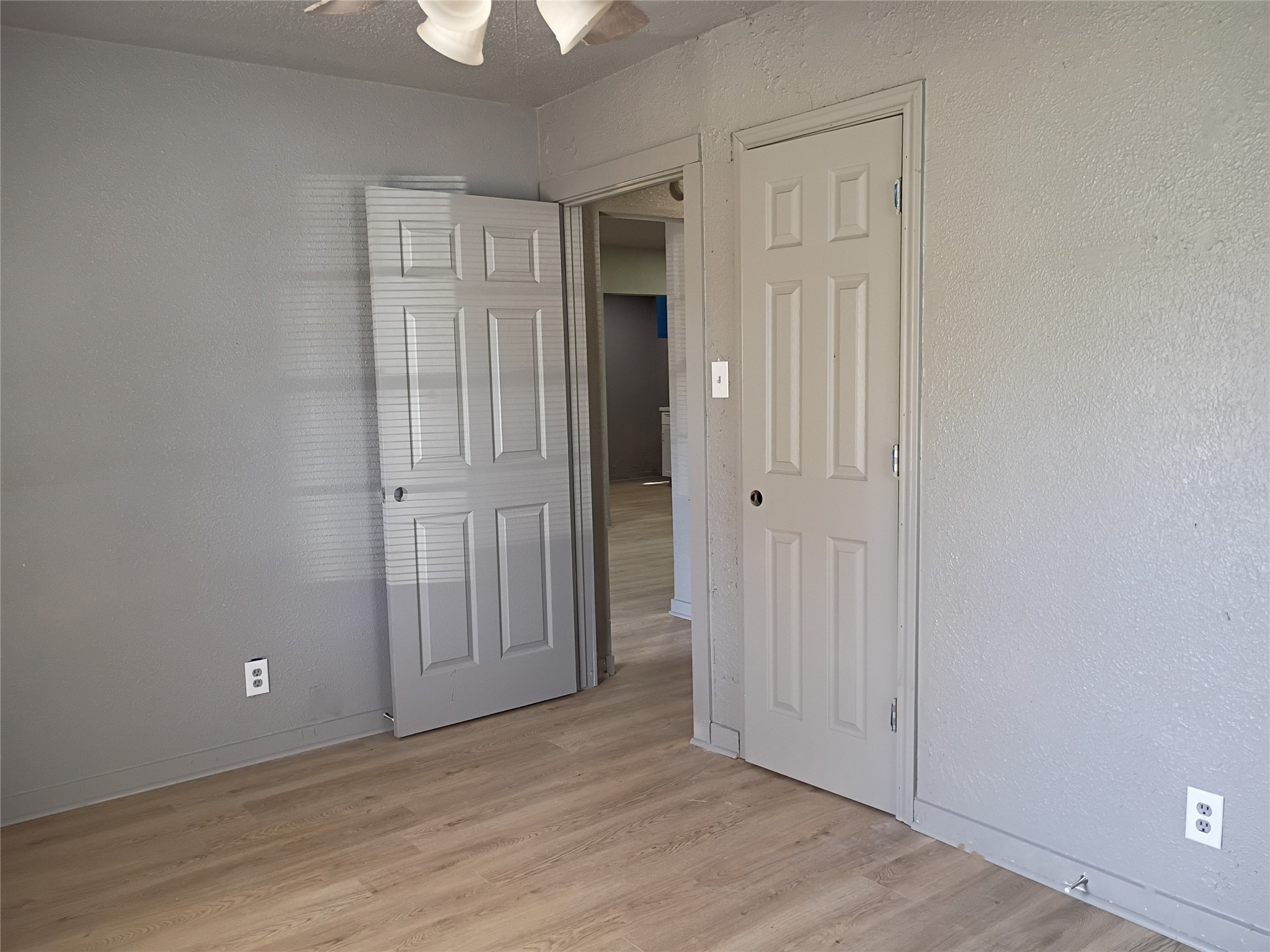 5617 Malmedy Road Houston, TX 77033 - Photo 9 of 12 an empty room with wooden floor