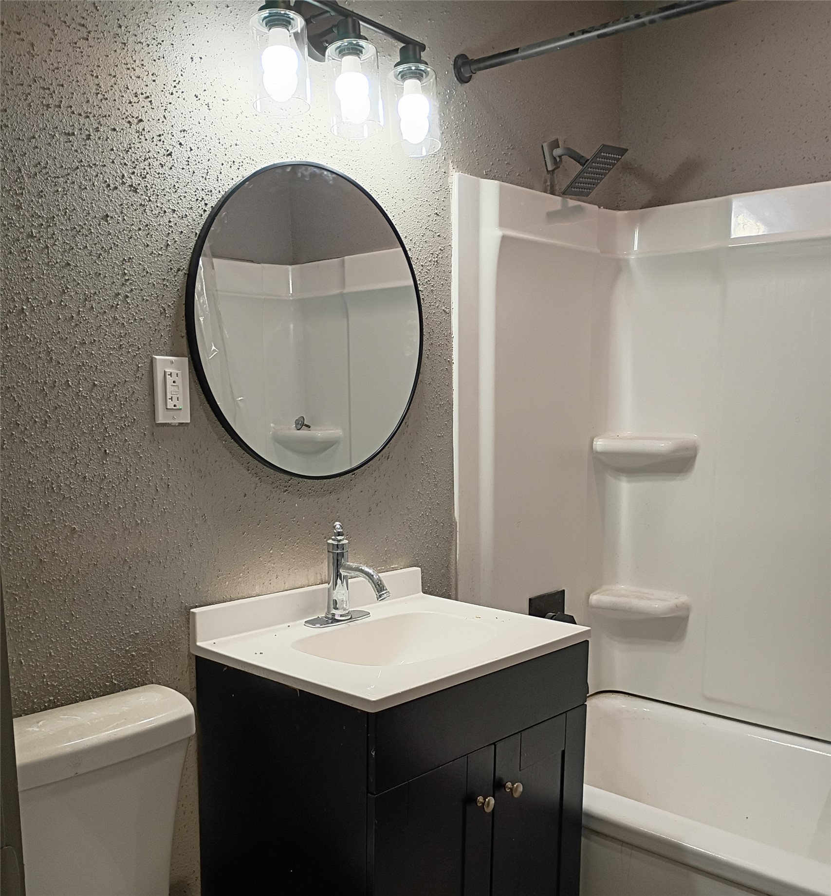 5617 Malmedy Road Houston, TX 77033 - Photo 10 of 12 a bathroom with a sink and a mirror