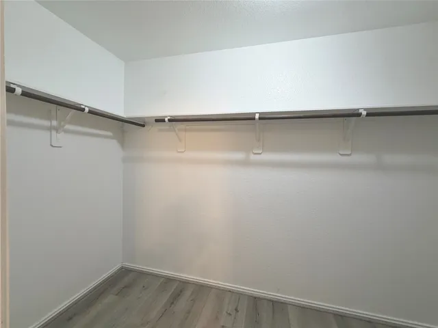 a view of an empty walk in closet