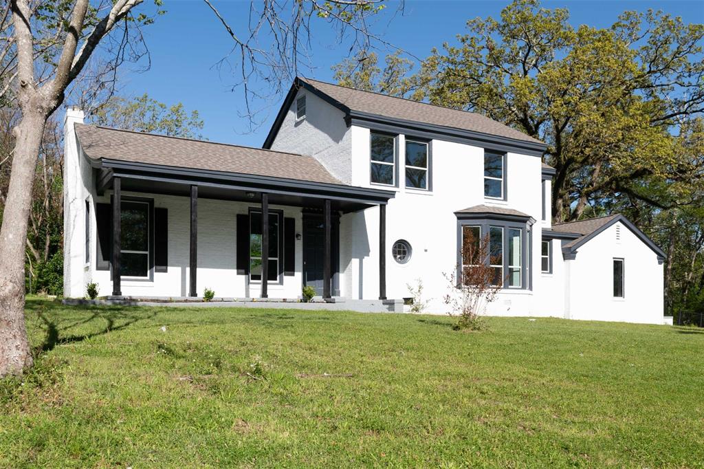 3072 South Hazel Street Arcadia, LA 71001 - Photo 1 of 1 a front view of a house with a yard