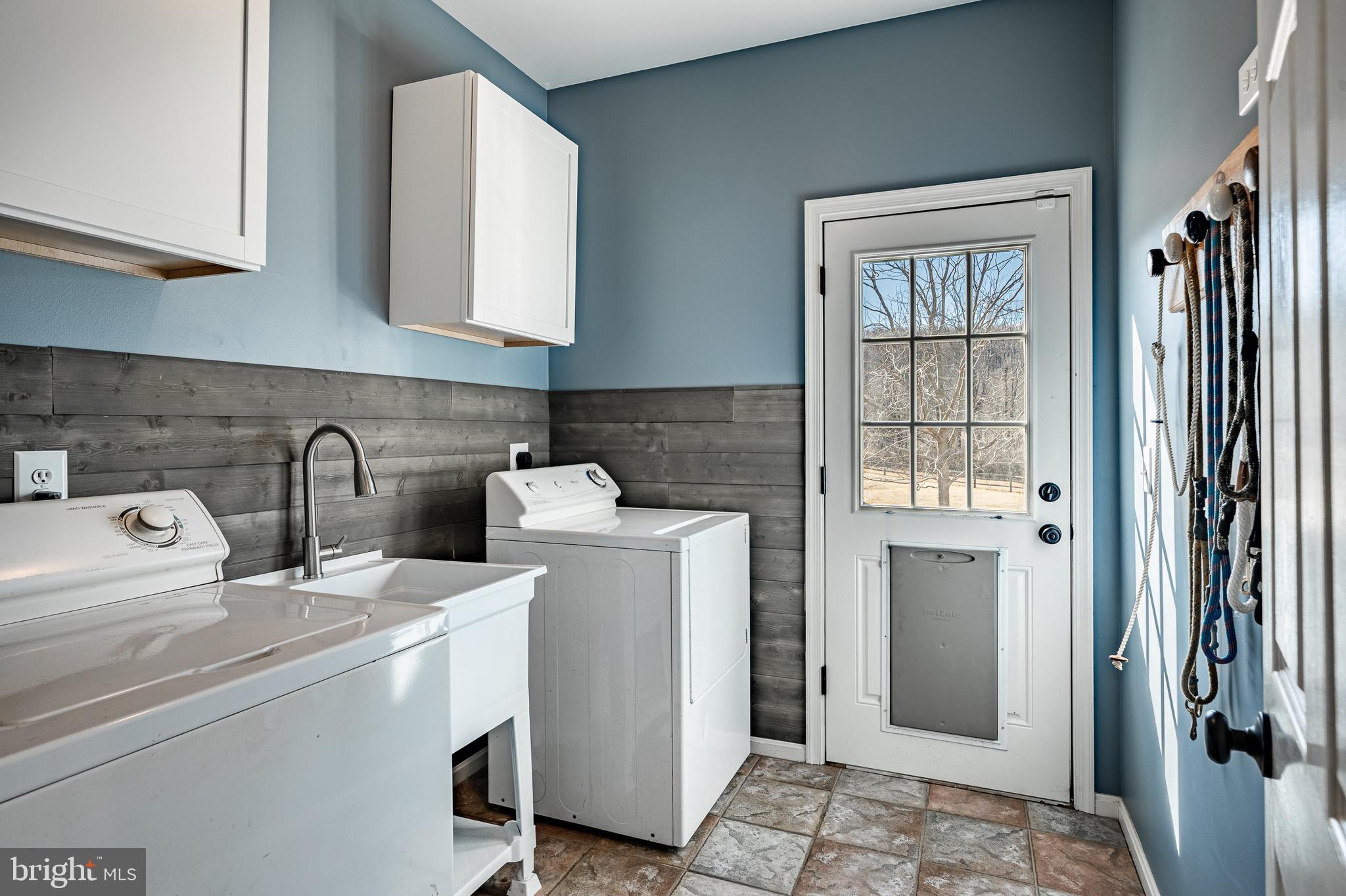 100 Rosepoint Road Glenmoore, PA 19343 - Photo 20 of 55 Laundry w/utility sink, cabinets & dog door