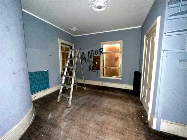 a view of an empty room with a window