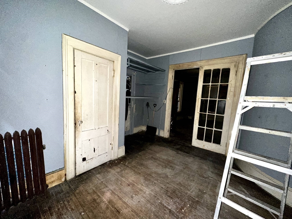 146 Bay Street Springfield, MA 01109 - Photo 14 of 39 a view of an empty room with wooden floor and a window