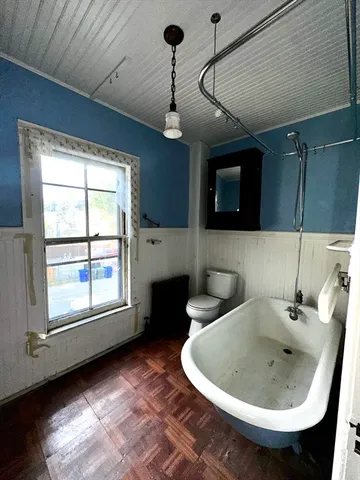 a kitchen with a sink appliances and cabinets