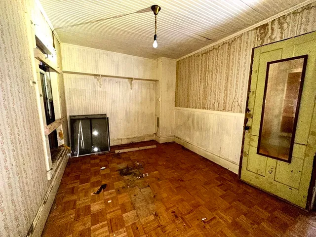 a kitchen with a refrigerator and a stove