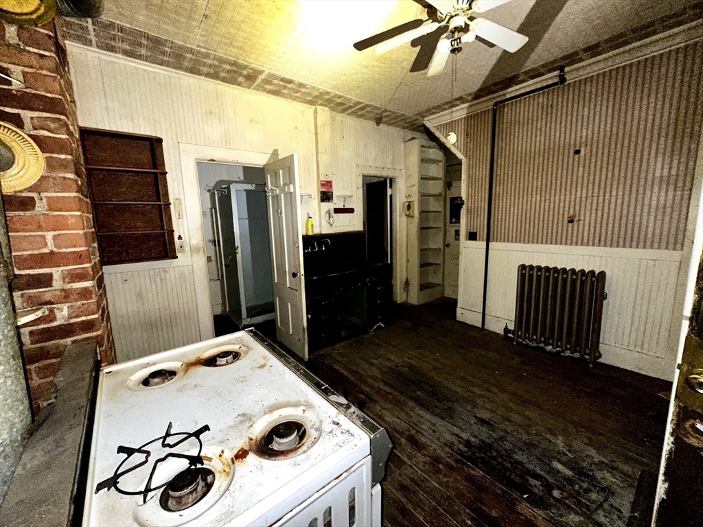 146 Bay Street Springfield, MA 01109 - Photo 3 of 39 a kitchen with a refrigerator and a stove
