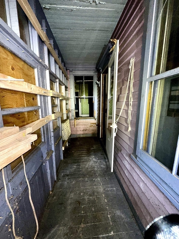 146 Bay Street Springfield, MA 01109 - Photo 8 of 39 a view of a porch with wooden floor and furniture