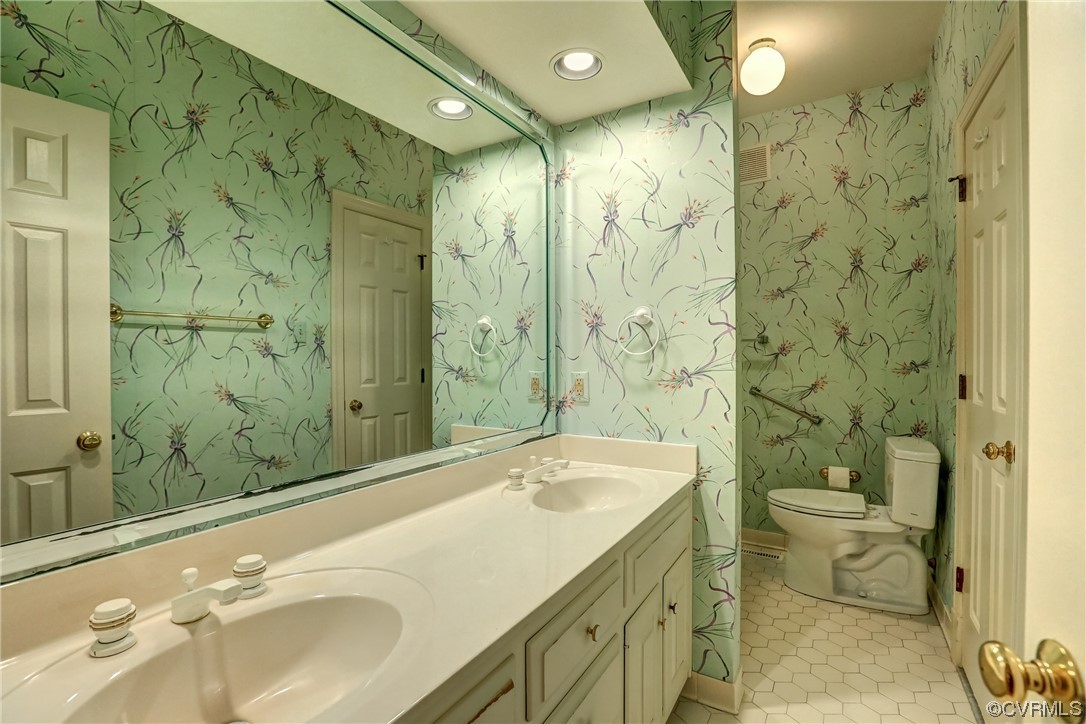 505 St Albans Way Henrico, VA 23229 - Photo 20 of 36 a bathroom with a sink and mirror with toilet