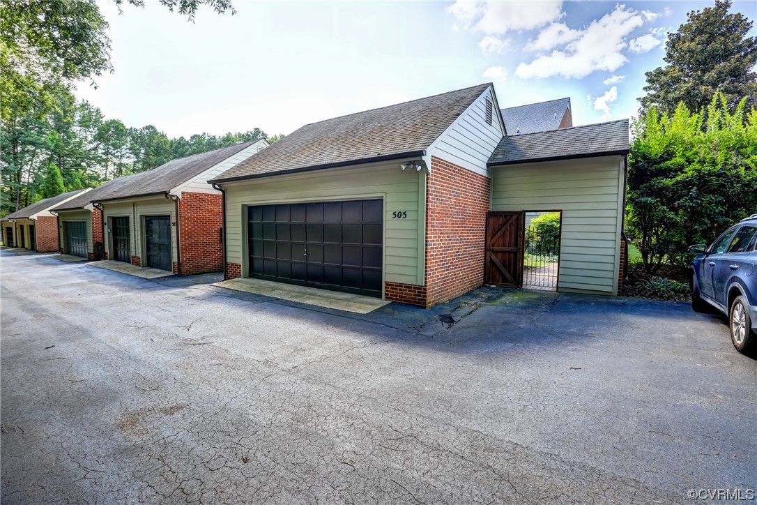 505 St Albans Way Henrico, VA 23229 - Photo 35 of 36 a view of a house with a yard and garage