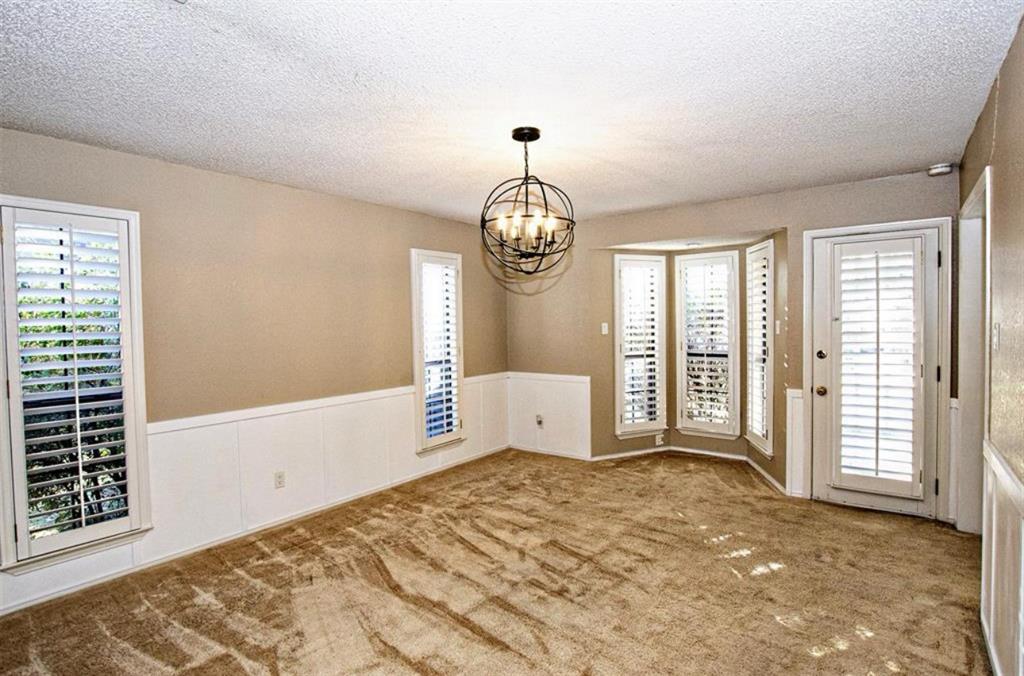 2202 Carriage Estates Road Sherman, TX 75092 - Photo 4 of 18 a spacious bedroom with a bed and a window