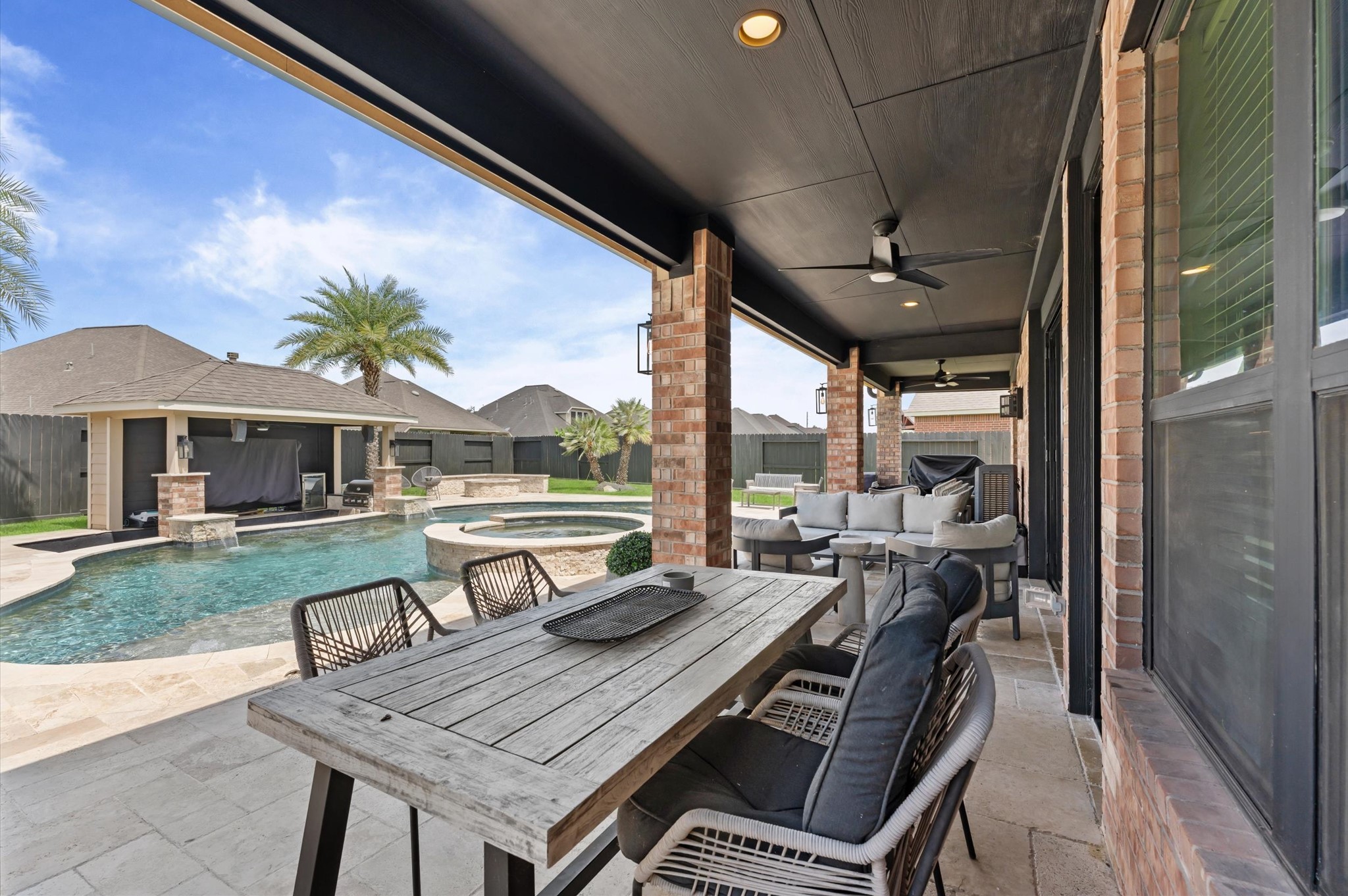 14016 Savannah Landing Lane Rosharon, TX 77583 - Photo 40 of 49 a view of a patio with table and chairs and potted plants