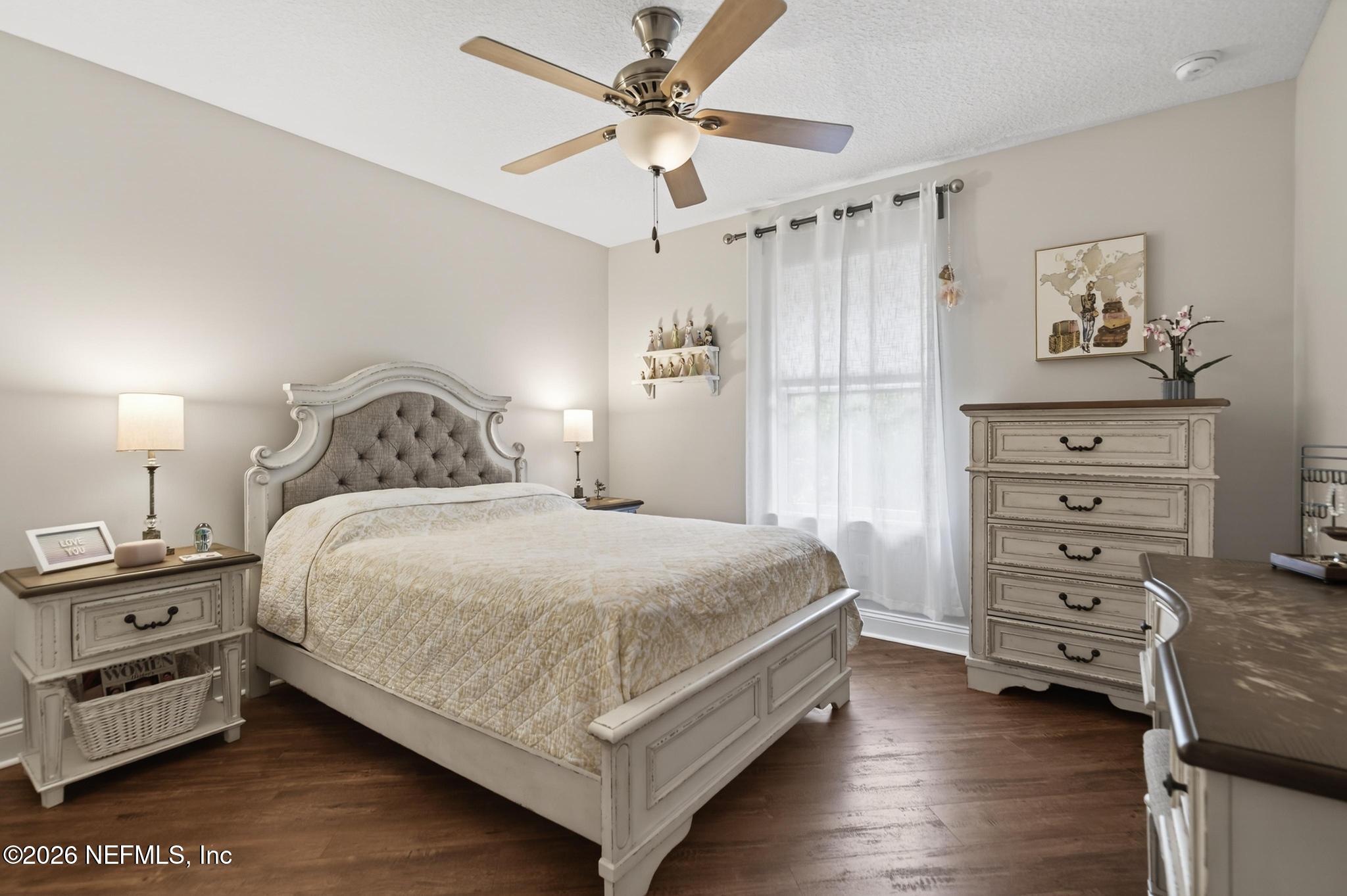 1906 North Loop Parkway St. Augustine, FL 32095 - Photo 14 of 87 a bedroom with a bed dresser and a window