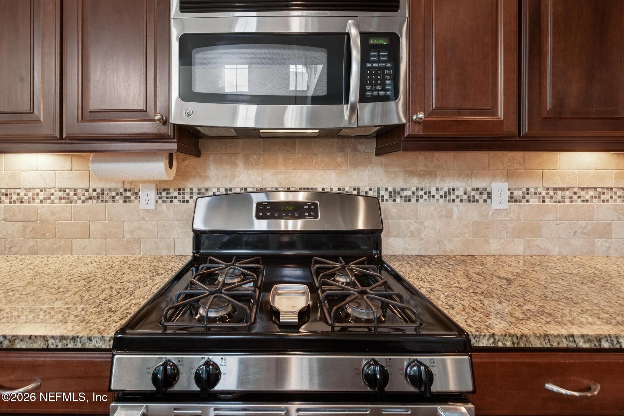 1906 North Loop Parkway St. Augustine, FL 32095 - Photo 26 of 87 a stove top oven sitting inside of a kitchen
