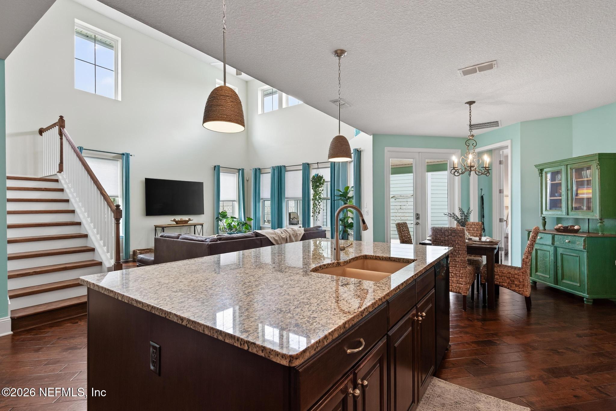 1906 North Loop Parkway St. Augustine, FL 32095 - Photo 30 of 87 a view of kitchen island a sink and living room view