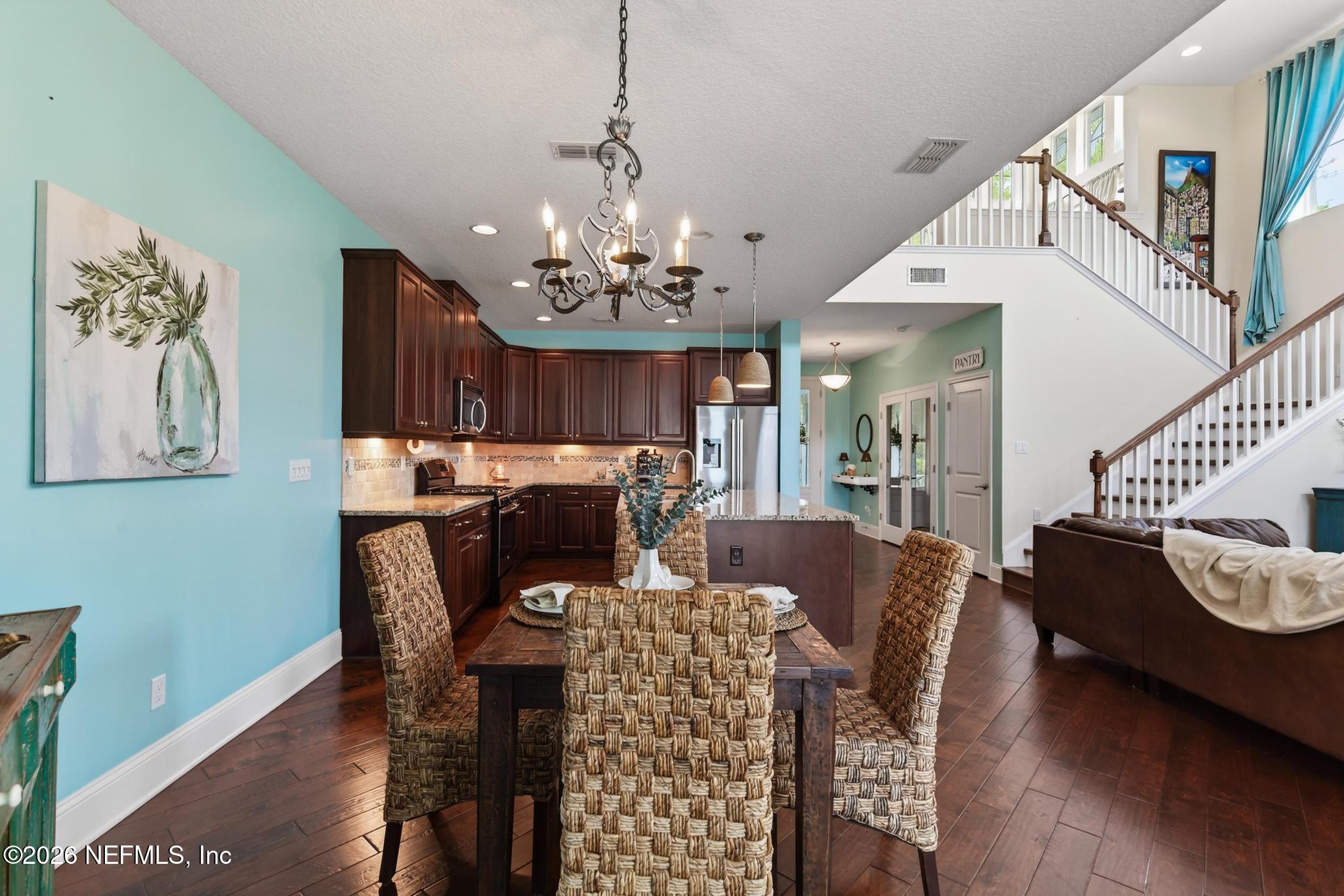 1906 North Loop Parkway St. Augustine, FL 32095 - Photo 36 of 87 a view of a dining room with furniture and chandelier