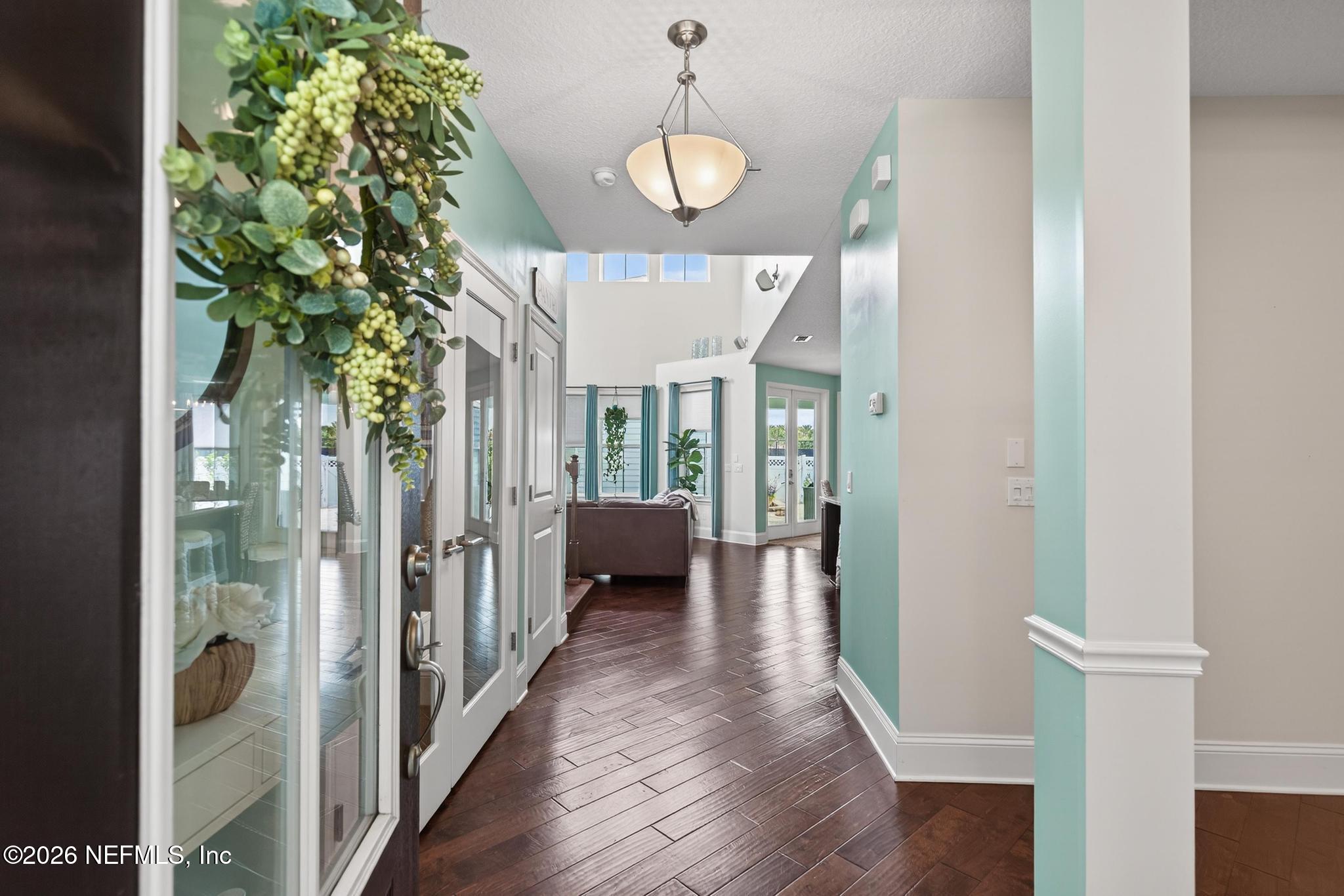 1906 North Loop Parkway St. Augustine, FL 32095 - Photo 37 of 87 a view of a hallway view with wooden floor and staircase
