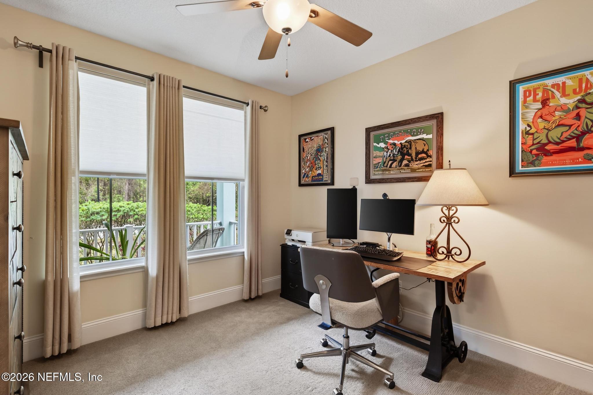 1906 North Loop Parkway St. Augustine, FL 32095 - Photo 39 of 87 a view of a workspace with furniture and a window