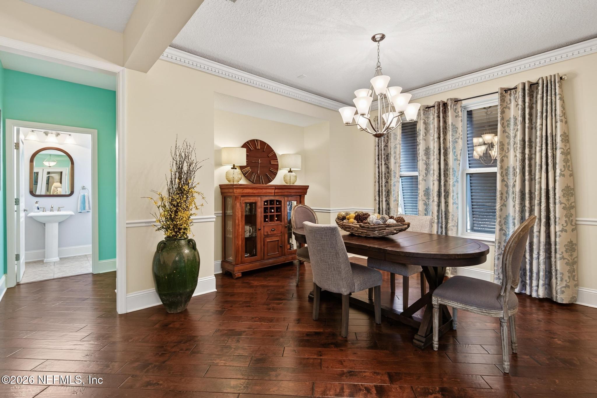 1906 North Loop Parkway St. Augustine, FL 32095 - Photo 41 of 87 a view of a dining room with furniture window and wooden floor