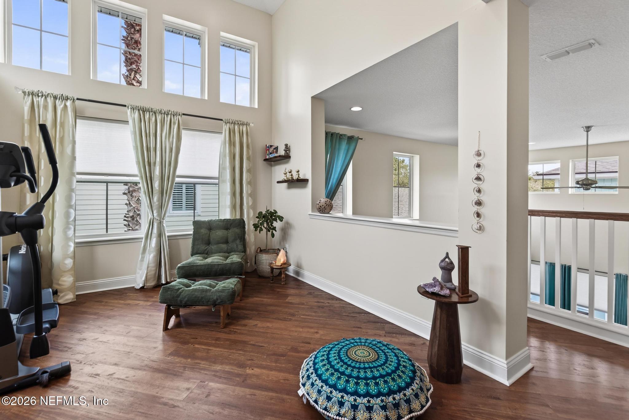 1906 North Loop Parkway St. Augustine, FL 32095 - Photo 53 of 87 a living room with furniture and a floor to ceiling window