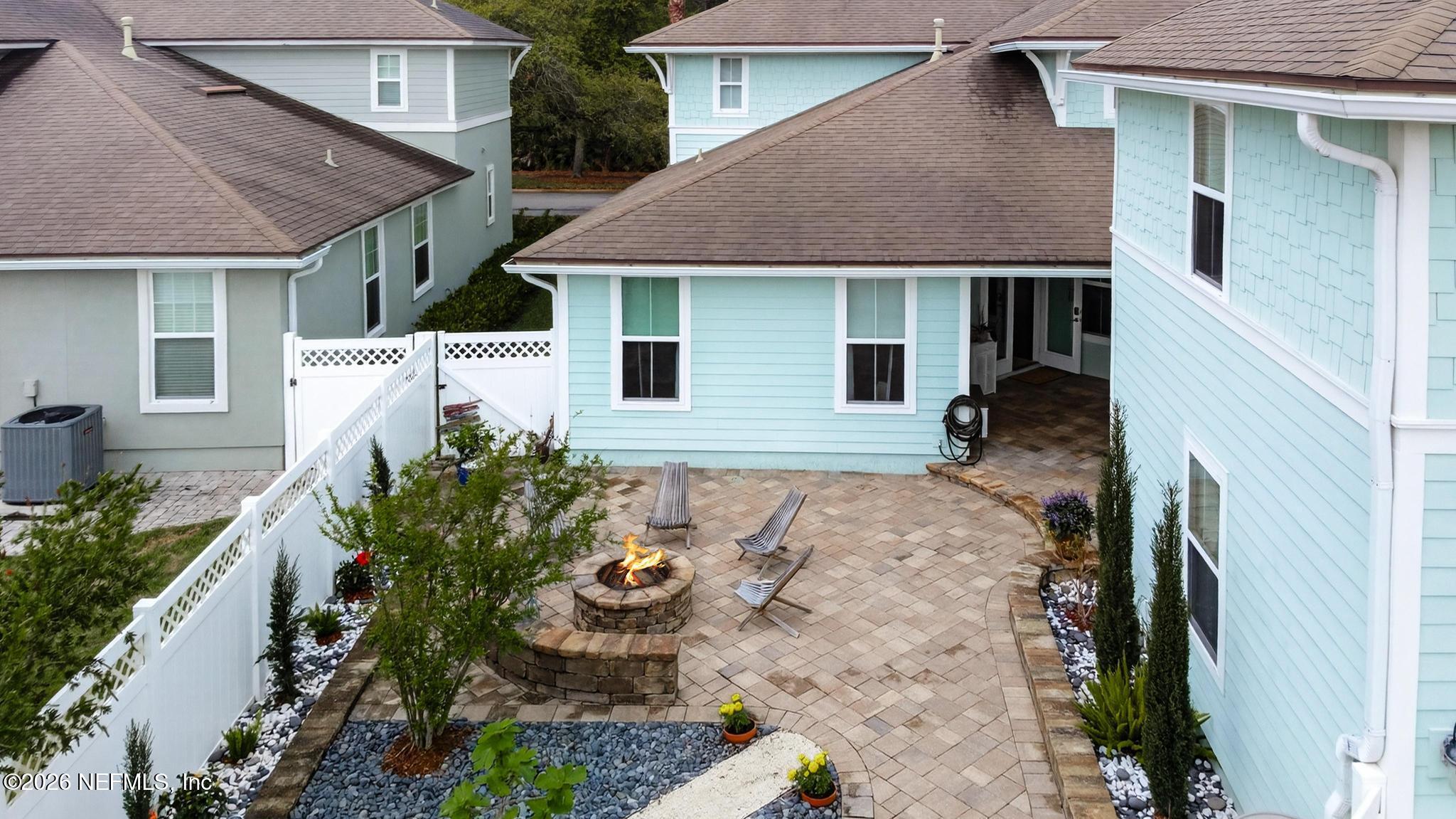 1906 North Loop Parkway St. Augustine, FL 32095 - Photo 68 of 87 a front view of a house with a yard and outdoor seating