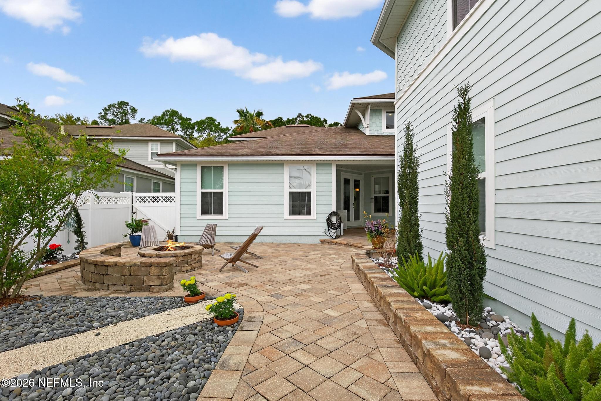 1906 North Loop Parkway St. Augustine, FL 32095 - Photo 75 of 87 a view of a patio with table and chairs and potted plants