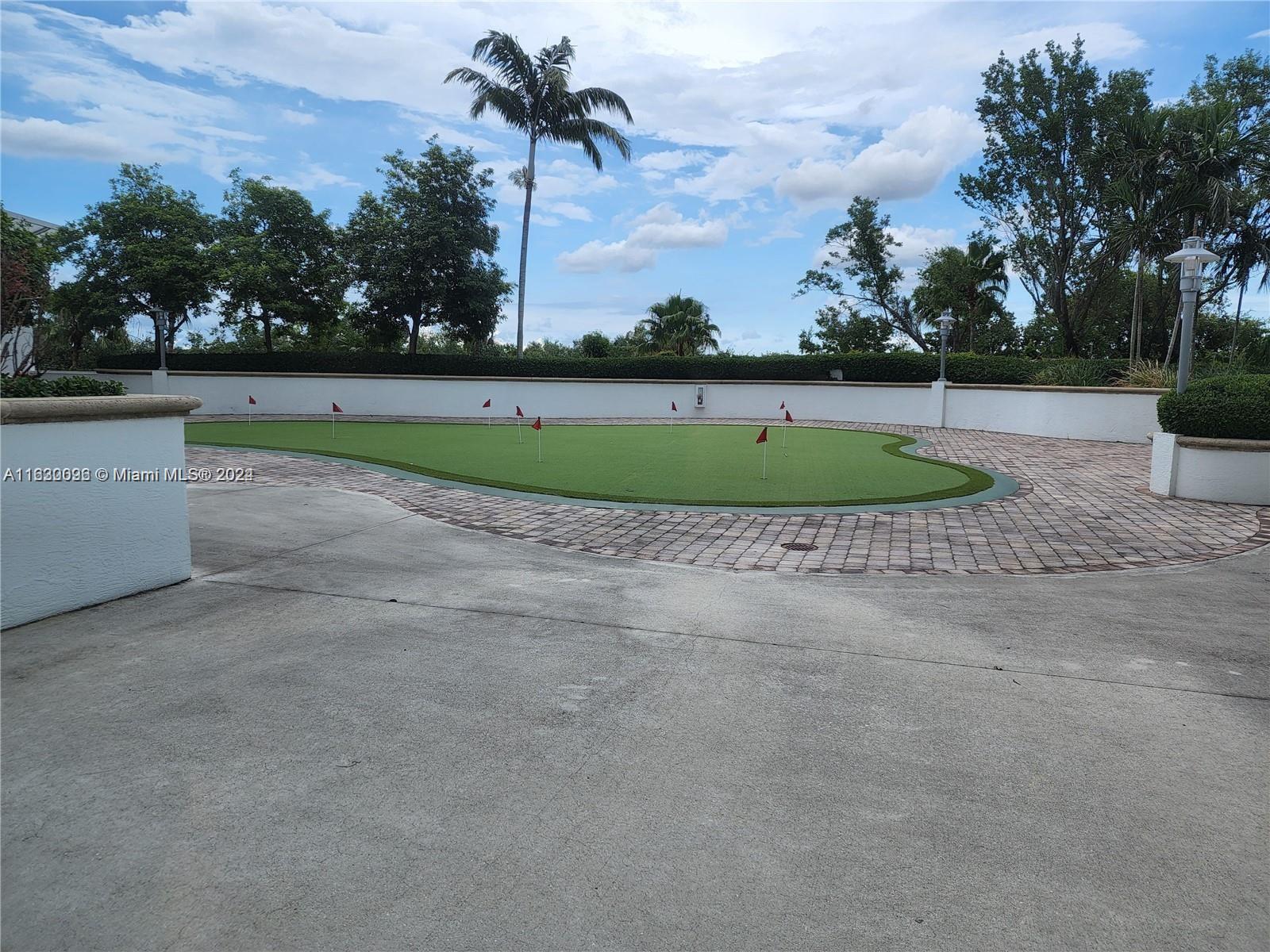 2641 North Flamingo Road, Unit 2007N Sunrise, FL 33323 - Photo 17 of 18 a view of a golf course with a lake