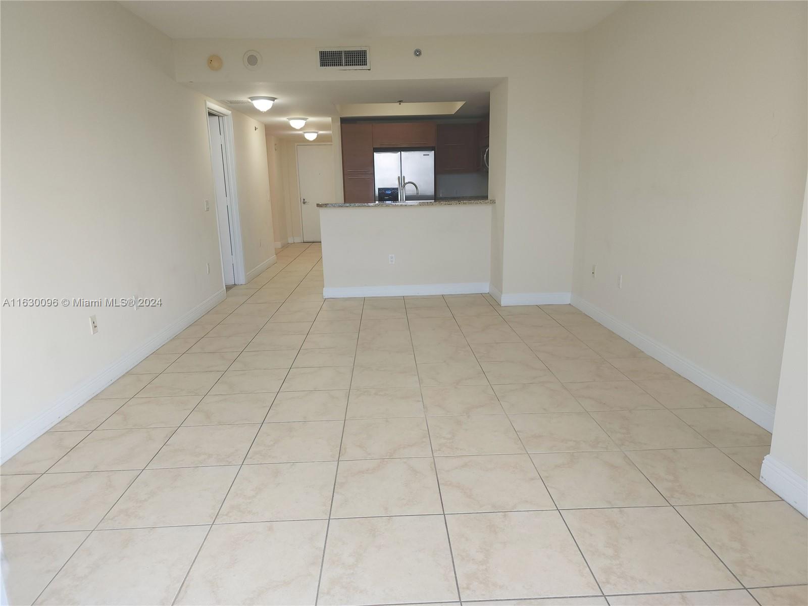 2641 North Flamingo Road, Unit 2007N Sunrise, FL 33323 - Photo 6 of 18 a view of a hallway to the kitchen