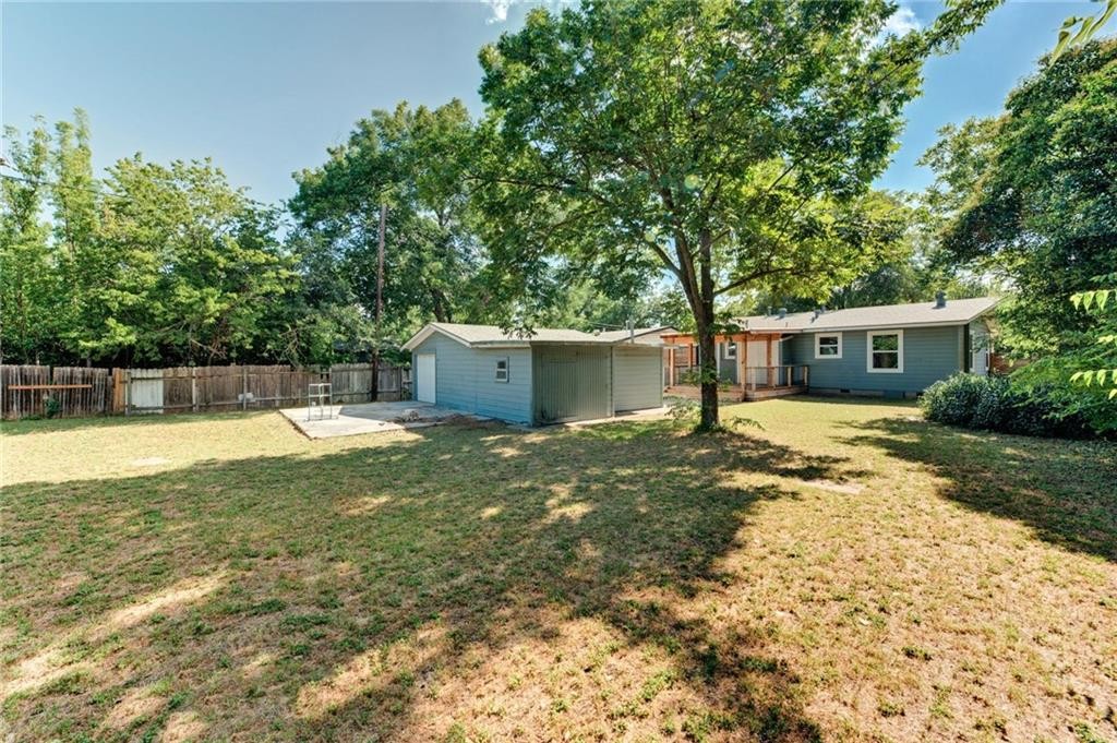 8318 Burrell Drive Austin, TX 78757 - Photo 25 of 27 Fenced backyard featuring a patio area and view of scattered trees