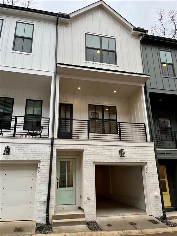 192 Chestnut Circle, Unit 46 Atlanta, GA 30342 - Photo 1 of 1 a building with a window and balcony