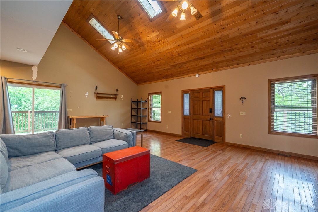 10584 New Biddinger Road Harrison, OH 45030 - Photo 9 of 61 This airy living area features gleaming hardwood floors and an inviting wood-paneled vaulted ceiling.