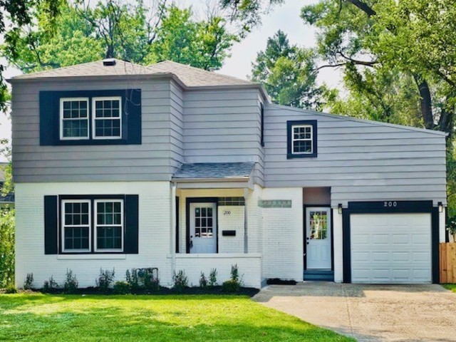 200 South Delaplaine Road Riverside, IL 60546 - Photo 1 of 21 a front view of a house with a yard