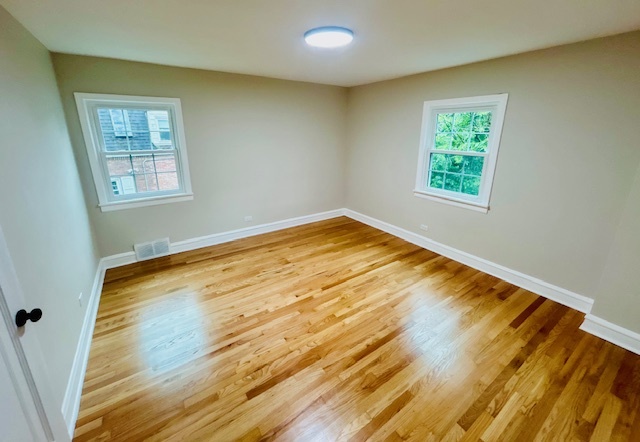 200 South Delaplaine Road Riverside, IL 60546 - Photo 17 of 21 a view of empty room with wooden floor and fan