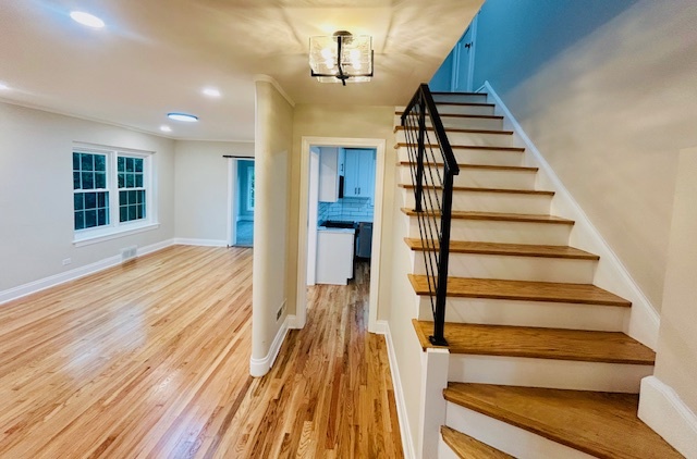 200 South Delaplaine Road Riverside, IL 60546 - Photo 5 of 21 a view of entryway with wooden floor and stairs