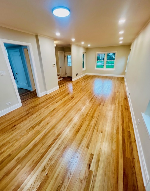 200 South Delaplaine Road Riverside, IL 60546 - Photo 6 of 21 a view of a big room with wooden floor and staircase