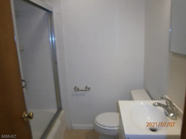 a kitchen with a sink a stove and a refrigerator