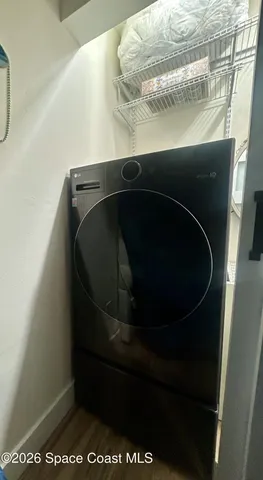 a bathroom with a toilet sink vanity tub and mirror