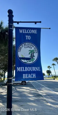 a view of outdoor space with garden and trees