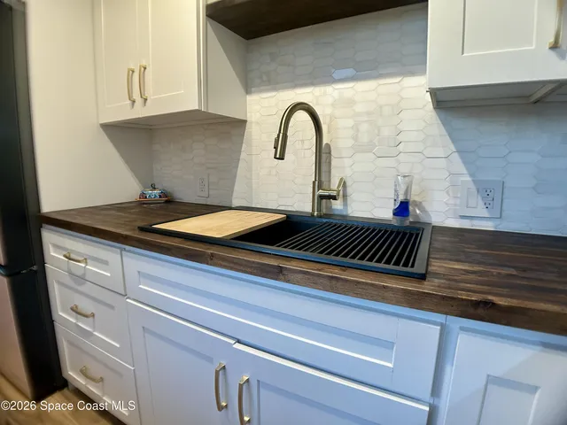 a kitchen with a stove and a microwave