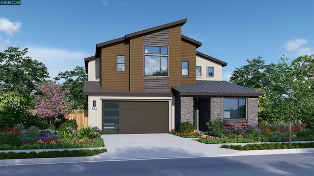 a front view of a house with a yard and a garage