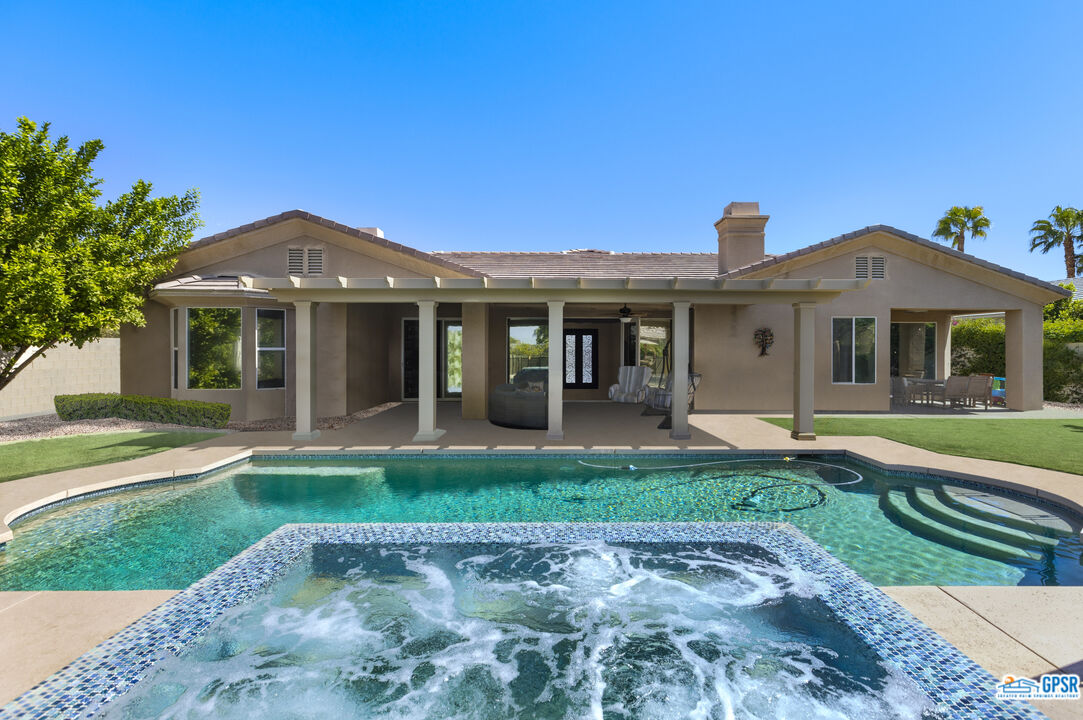 9 Orleans Road Rancho Mirage, CA 92270 - Photo 1 of 3 a front view of a house with a yard