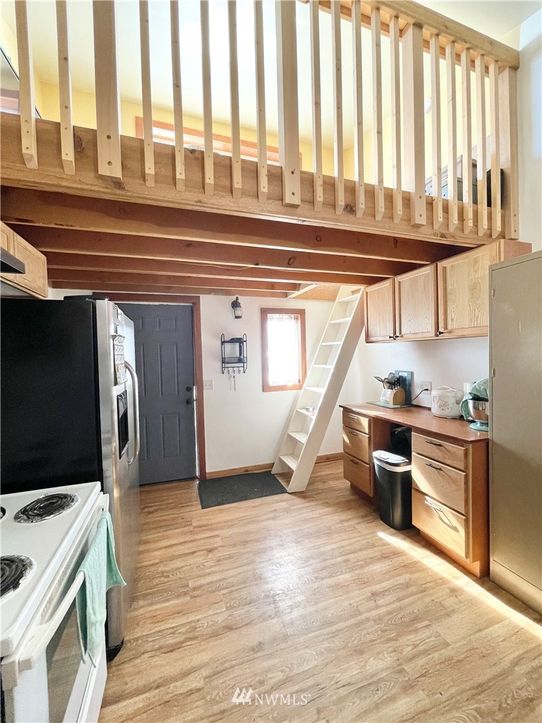 179 Tonasket Airport Road Tonasket, WA 98855 - Photo 12 of 31 a view of a kitchen with a sink and microwave