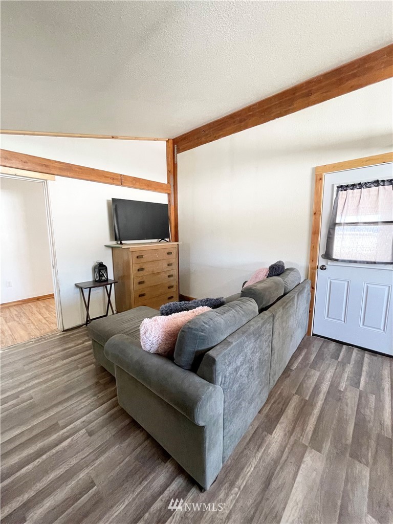179 Tonasket Airport Road Tonasket, WA 98855 - Photo 16 of 31 a living room with furniture and a wooden floor