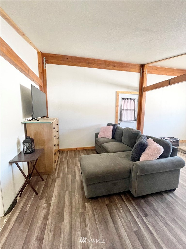 179 Tonasket Airport Road Tonasket, WA 98855 - Photo 17 of 31 a living room with furniture and a wooden floor