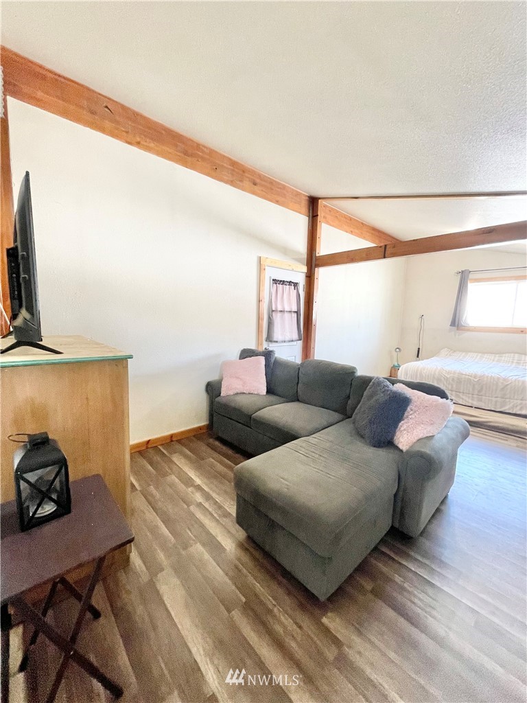 179 Tonasket Airport Road Tonasket, WA 98855 - Photo 18 of 31 a living room with furniture and a flat screen tv