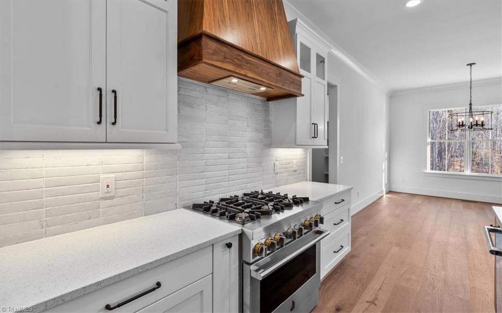 7999 Cokely Court Oak Ridge, NC 27310 - Photo 20 of 49 6 burner professional gas range with hood