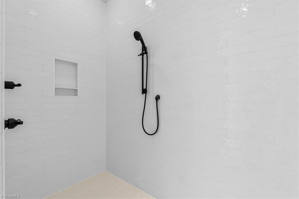 7999 Cokely Court Oak Ridge, NC 27310 - Photo 34 of 49 walk in tile shower