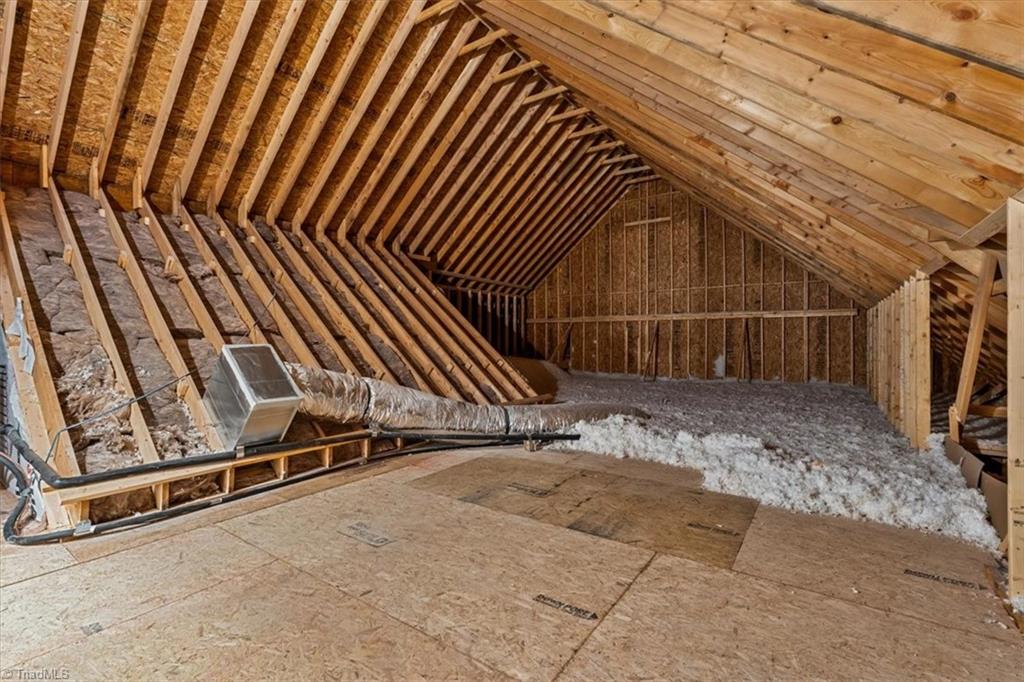 7999 Cokely Court Oak Ridge, NC 27310 - Photo 43 of 49 walk in attic storage