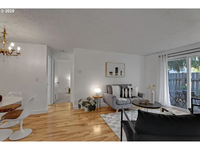 a living room with furniture and a table