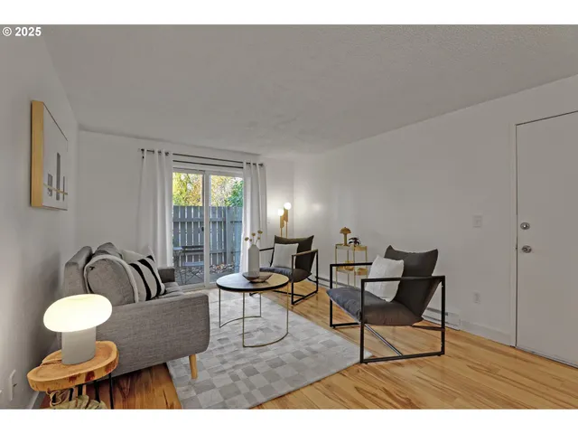 a living room with furniture and a lamp