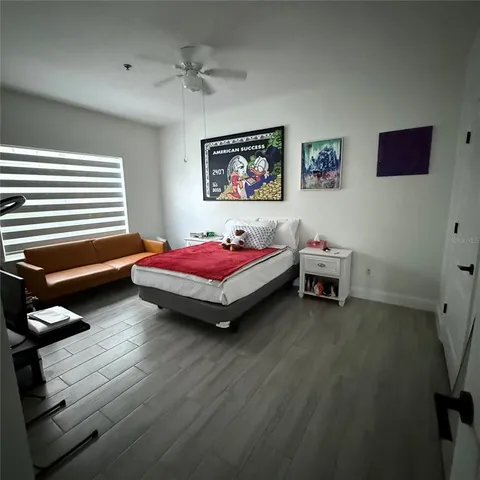 a bedroom with bed and a window